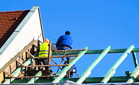 workers working on roof
